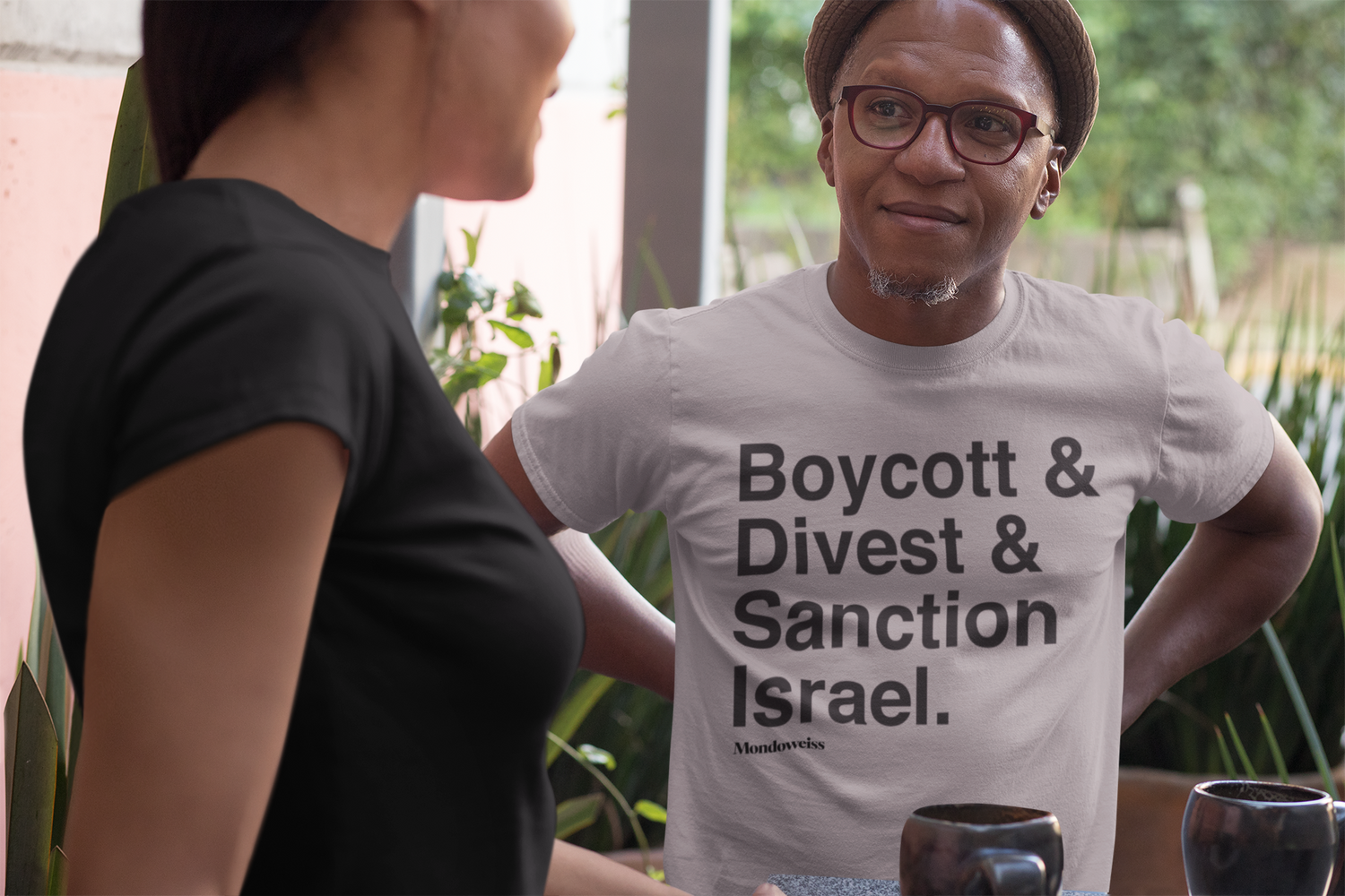 Hip cool dude sports a BDS t-shirt at a coffee shop.